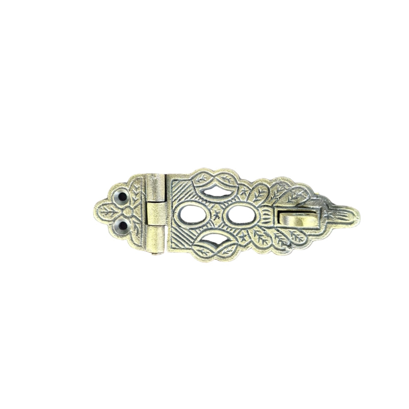 Decorative brass door latch on a white background