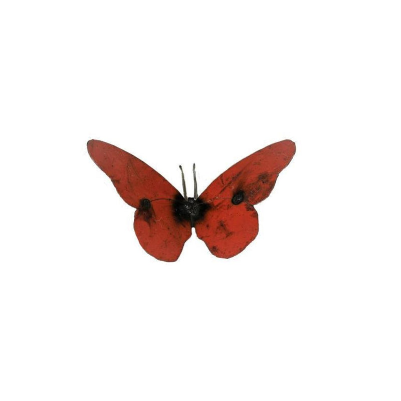 Red butterfly toy on a white background