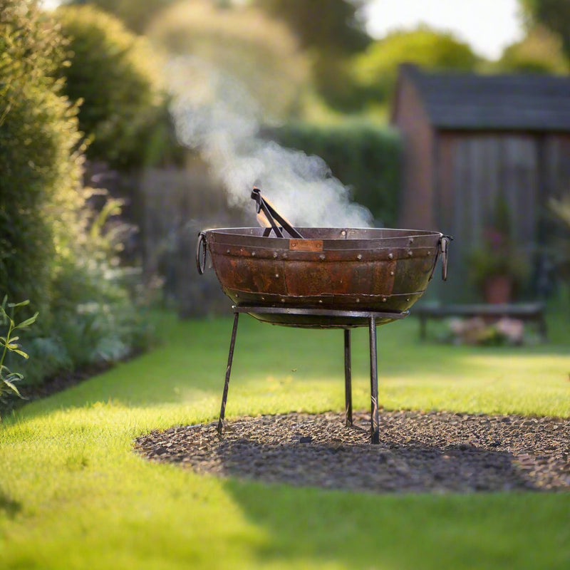 Rustic metal fire pit in a garden in the countryide