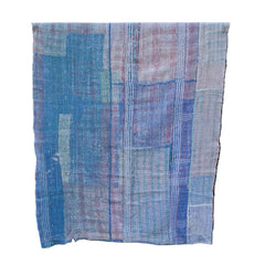 A patchwork-style woven textile with blue, pink, and lavender plaid sections, on a white background