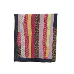 kantha throw made of recycled fabrics with red, yellow, purple and black floral stripes