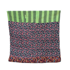 kantha throw made of recycled fabrics with floral designs in green, red and black