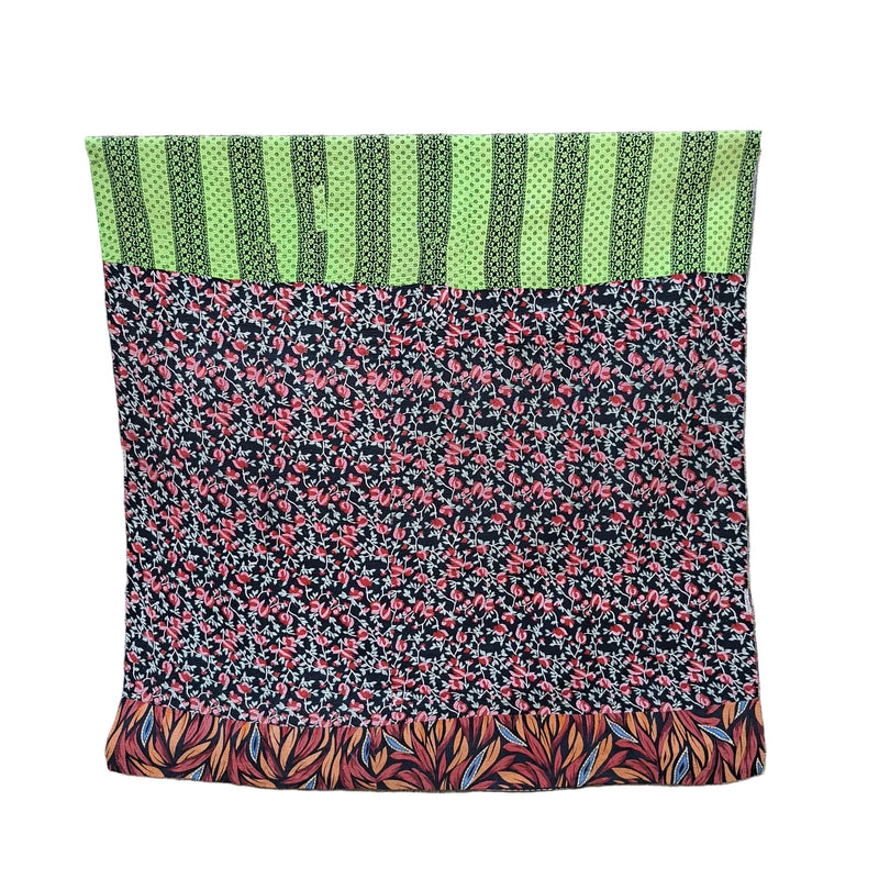 kantha throw made of recycled fabrics with floral designs in green, red and black
