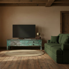 vintage green blue media unit with a TV in a living room