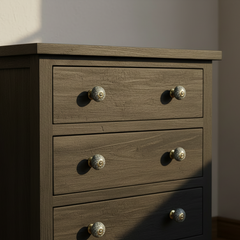 Decorative knob with floral pattern on a chest of drawers