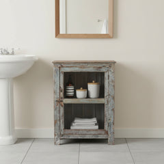 Rustic wooden cabinet with weathered finish in a bathroom