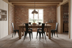 rustic style dining room with 6 black metal chair around a wood table