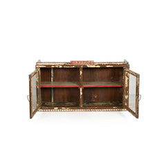 Wall cabinet with 2 glass doors in natural wood with cream paint distressed, open view showing one inner shelf where the edge have been paited in bright red.