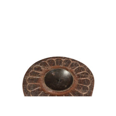 round wood candle holder with a floral carving on a white background