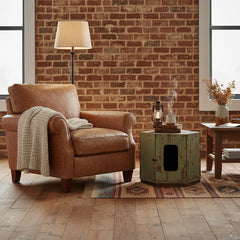 Hexagonal wooden cabinet with a distressed finish in a living room