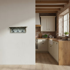 Wooden wall shelf with three hooks in a kitchen background
