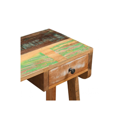 A rustic wooden side table with a distressed patchwork top featuring green and brown wood tones, a single drawer with a black knob, and two legs, shown on a plain white background.