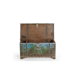 Wooden trunk with a decorative emblem on a white background