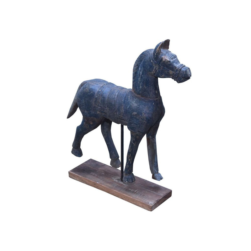 Wooden horse sculpture on a stand with a white background