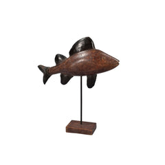 Wooden fish sculpture on a stand against a white background
