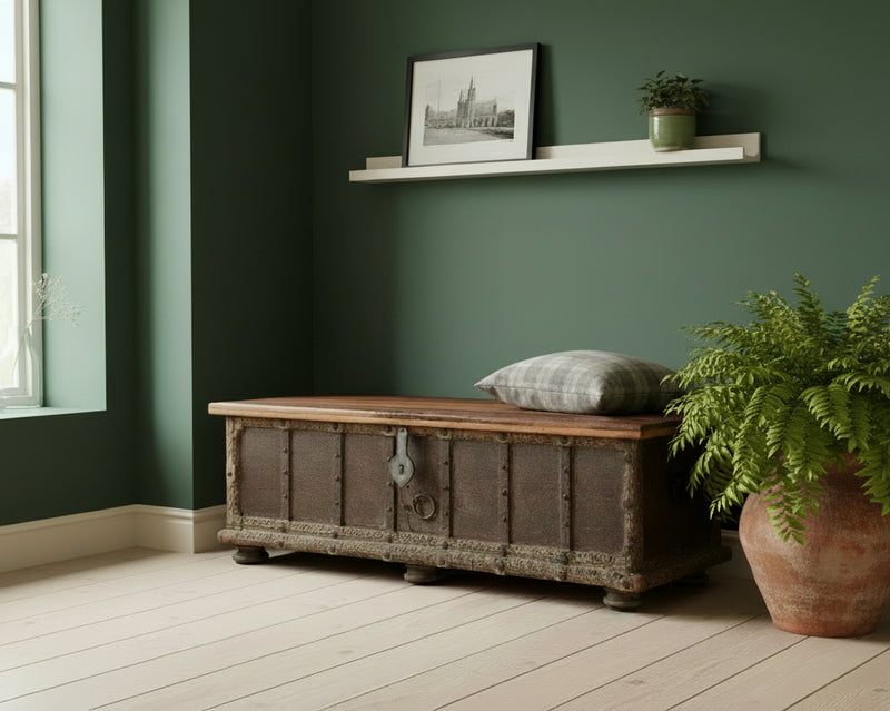 Bharata Wooden Trunk Dark Brown Shekhawati 7 Panel Door With Light Lid Option 7 Front in an entrance against a dark green wall