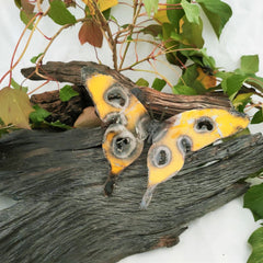 Jeff Butterfly Recycled Metal yellow colour on log 