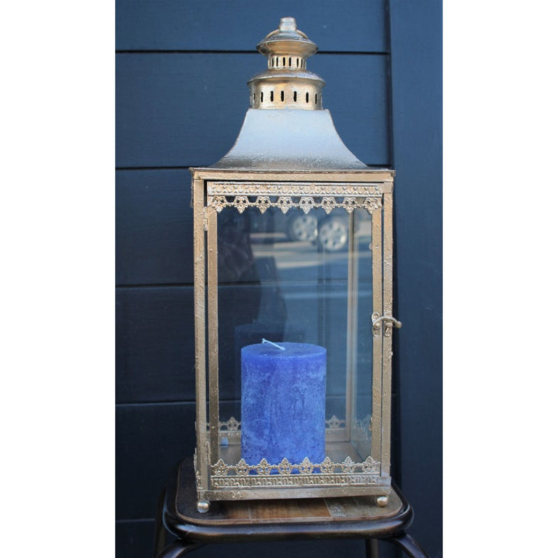 Chantal Lantern gold colour with blue candle outside