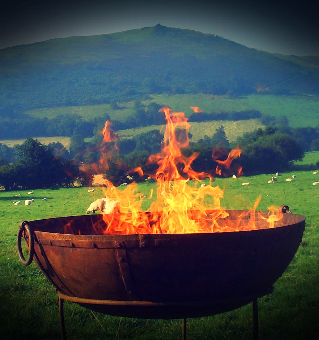 Kadai Fire Pit Bowl BBQ With Fire Inside in a field