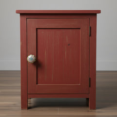 multicolour ceramic knob on a rustic red locker