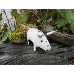 White Recycled Metal Pig front view on log
