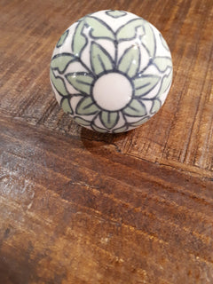 Taj green ceramic door knob on table view