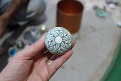 Taj Green ceramic knob in hand shows size 