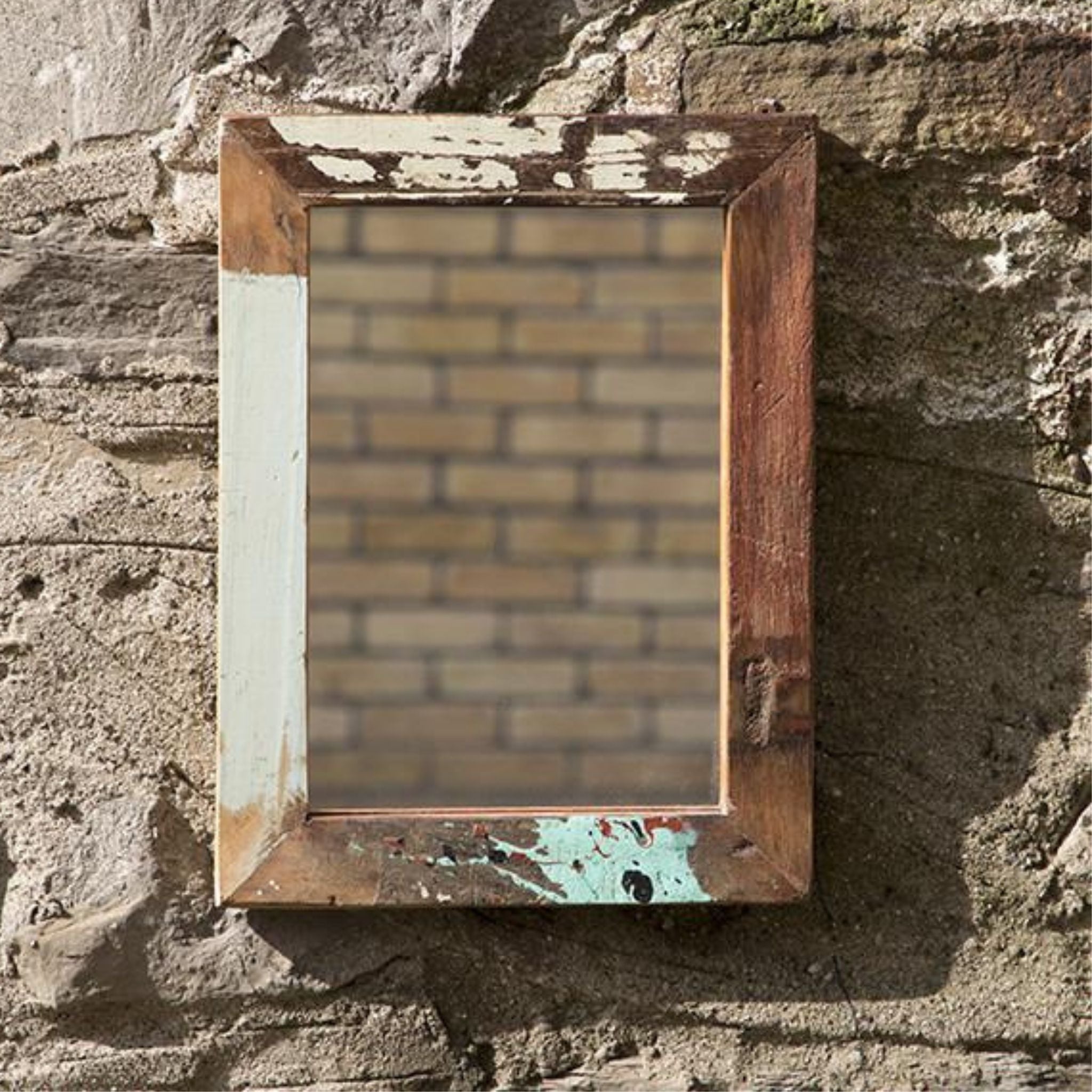 The Koli Mirror frame from mixed, coloured reclaimed wood on Outside Wall With Natural Light