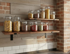 2 wall reclaimed wood shelves with black brackets on a rustic kitchen brick wall 